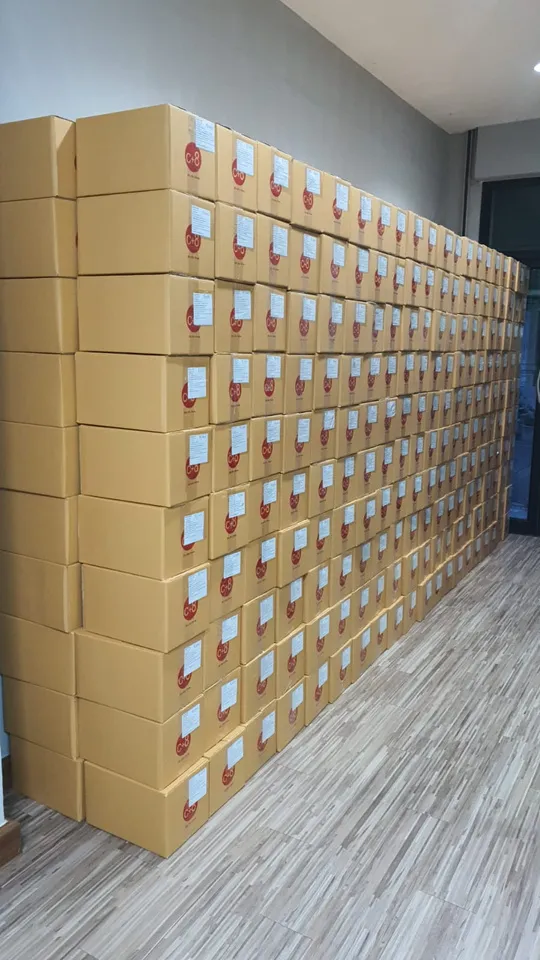 Stacked shipping cartons in the Nong Chok logistics centre waiting for dispatch