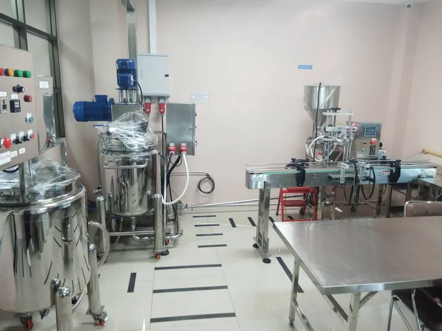 Filling line and stainless-steel mixing tanks in PAN's cosmetics factory